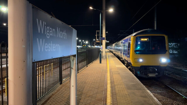 First shot of an electric train leaving Wigan Station