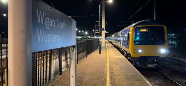 First shot of an electric train leaving Wigan Station